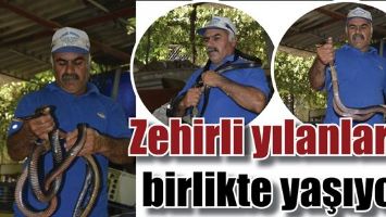 ZEHİRLİ YILANLARLA BİRLİKTE YAŞIYOR