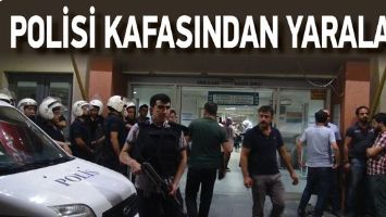 POLİSİ KAFASINDAN YARALADI!