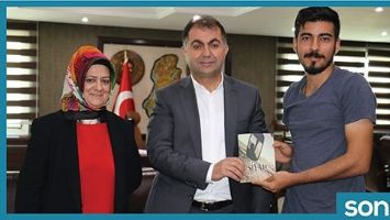 İLK KİTABINI, EŞ BAŞKANLARA HEDİYE ETTİ