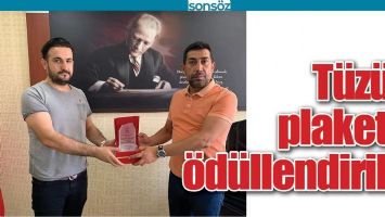 T&Uuml;Z&Uuml;N, PLAKETLE &Ouml;D&Uuml;LLENDİRİLDİ