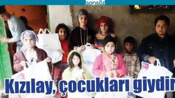 KIZILAY, &Ccedil;OCUKLARI GİYDİRDİ