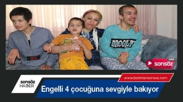 Engelli 4 &ccedil;ocuğuna sevgiyle bakıyor