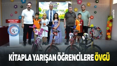 Kitapla yarışan &ouml;ğrencilere &ouml;vg&uuml;&hellip;