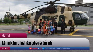 Minikler, helikoptere bindi