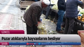 Pazar atıklarıyla hayvanlarını besliyor