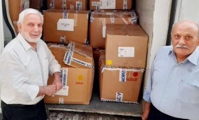 Siirtliler, &ouml;ğrencileri kışlık kıyafetle ısıttı