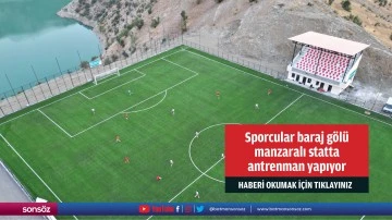 Sporcular baraj g&ouml;l&uuml;  manzaralı statta  antrenman yapıyor