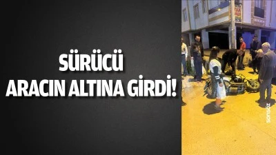S&uuml;r&uuml;c&uuml;, aracın altına girdi!