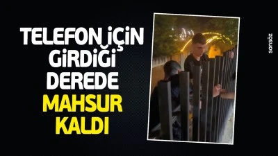 Telefon i&ccedil;in girdiği derede mahsur kaldı