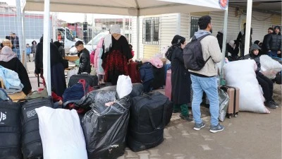 T&uuml;rkiye'deki Suriyelilerin Kilis'ten &uuml;lkelerine d&ouml;n&uuml;ş&uuml; s&uuml;r&uuml;yor
