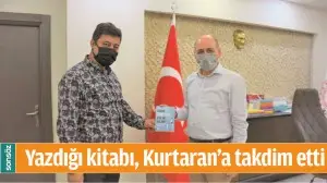 YAZDIĞI KİTABI, KURTARAN'A TAKDİM ETTİ