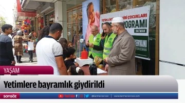 Yetimlere bayramlık giydirildi